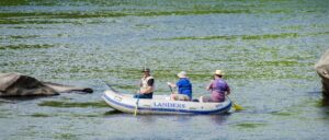 3 men in raft on Delaware River