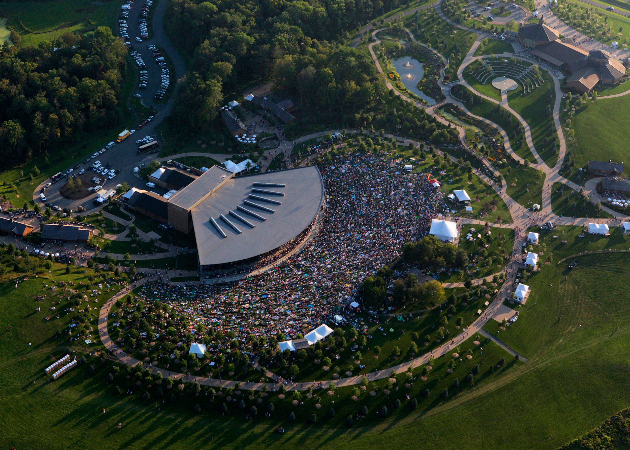bird's eye view of bethel woods center for the arts large music festival crowd